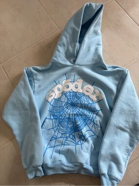 Sp5der Light Blue Hooded Sweatshirt with Spiderweb Graphic